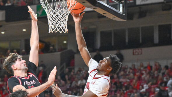 Arkansas Razorbacks guard Karter Knox laying in a shot against the Fresno State Bulldogs