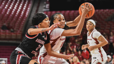 Arkansas Razorbacks guard Taleyah Jones drives the lane against the Arkansas State Red Wolves