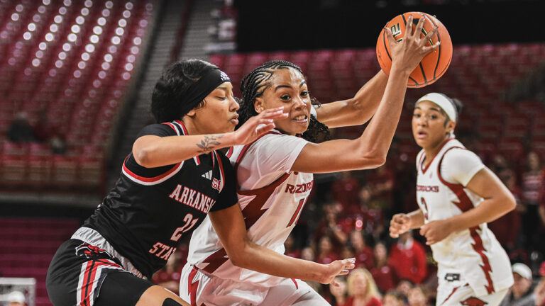 Arkansas Razorbacks guard Taleyah Jones drives the lane against the Arkansas State Red Wolves