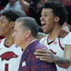 Arkansas Razorbacks coach John Calipari with players Meleek Thomas and Malique Ewin near end of win over the South Carolina Gamecocks
