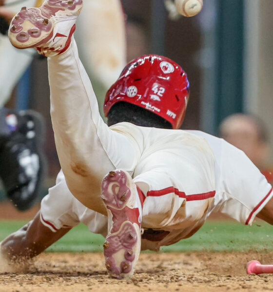 Arkansas Razorbacks' Damian Ruiz scores winning run against the Texas Tech Red Raiders.