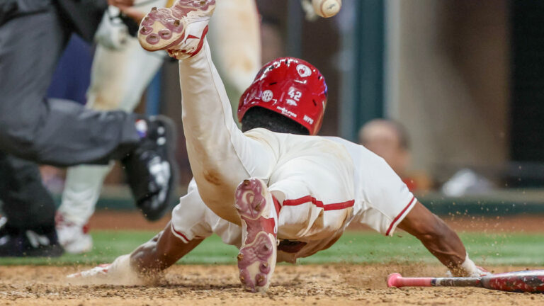 Arkansas Razorbacks' Damian Ruiz scores winning run against the Texas Tech Red Raiders.