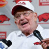 Former Arkansas Razorbacks coach Lou Holtz with the media before game with Notre Dame in 2025