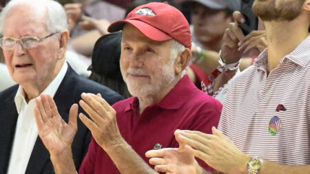 John Tyson courtside at an Arkansas Razorbacks basketball game