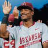 Arkansas junior outfielder Damian Ruiz high fives teammates after the Razorbacks' 8-1 win against Texas in a SEC Tournament game. | SEC/X