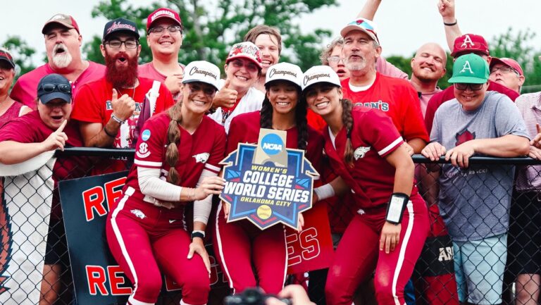 Arkansas softball players pose for photos with fans after the Razorbacks' 10-2 win against Duke that secured a spot in the Women's College World Series. | Arkansas Communications
