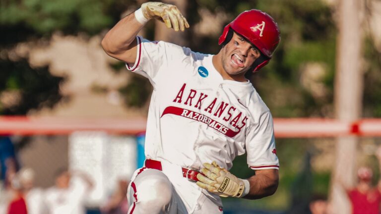 Arkansas catcher Ryder Helfrick celebrates a double against Missouri State in a NCAA Regional game in Lawrence, Kansas. | Arkansas Communications