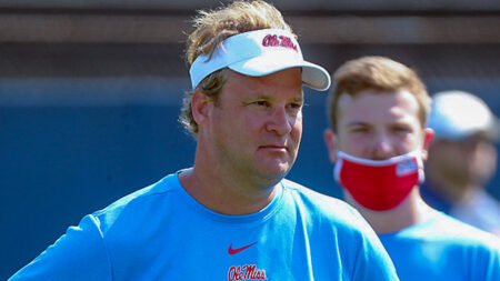 Ole Miss Rebels coach Lane Kiffin in pregame warmups before a game against the Arkansas Razorbacks at Vaught-Hemingway Stadium