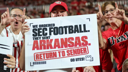 Utah fans with signs during Utes' domination of the Arkansas Razorbacks on Sunday night in Salt Lake City, Utah