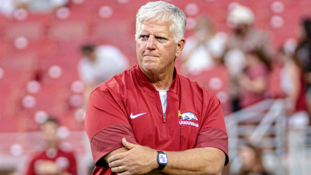 Arkansas Razorbacks defensive coordinator Ron Roberts on the field in warmups before game against the Tulsa Golden Hurricane at Razorback Stadium