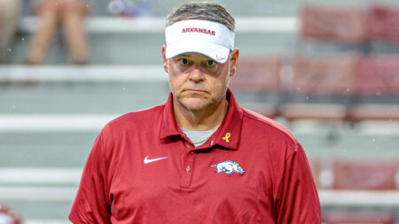 Arkansas Razorbacks offensive coordinator Tim Cramsey on the field before game against the Tulsa Golden Hurricane at Razorback Stadium
