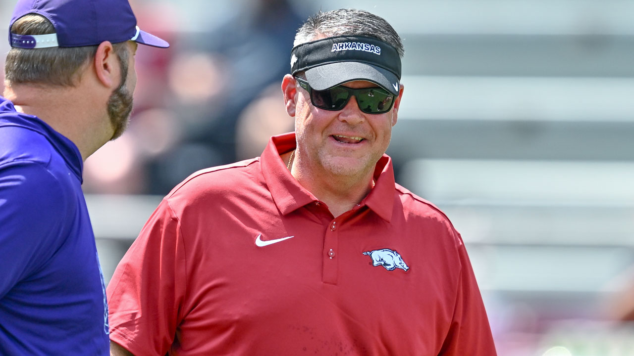 Arkansas Razorbacks offensive coordinator Tim Cramsey on the field before game against North Alabama at Razorback Stadium