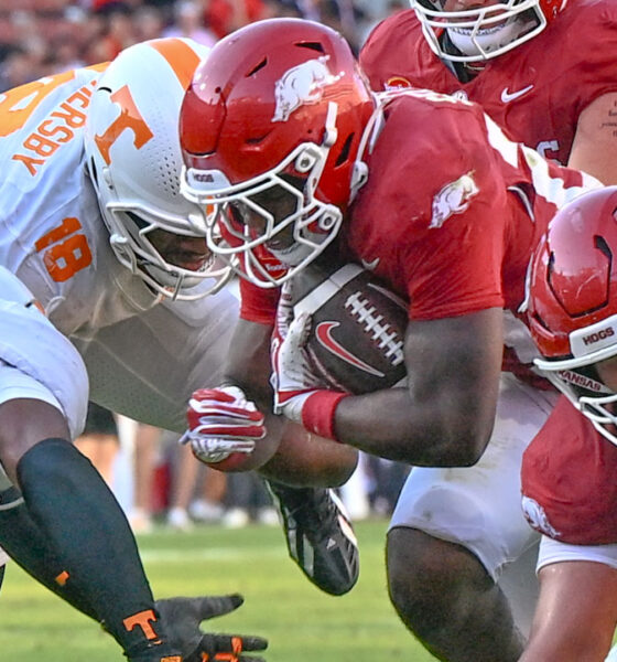 Arkansas Razorbacks running back tries to get yardage in a game against the Tennessee Volunteers at Razorback Stadium