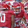 Arkansas Razorbacks tight end Jaden Platt celebrates a second-half touchdown with teammates against the Tennessee Volunteers at Razorback Stadium