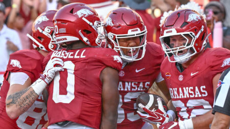 Arkansas Razorbacks tight end Jaden Platt celebrates a second-half touchdown with teammates against the Tennessee Volunteers at Razorback Stadium