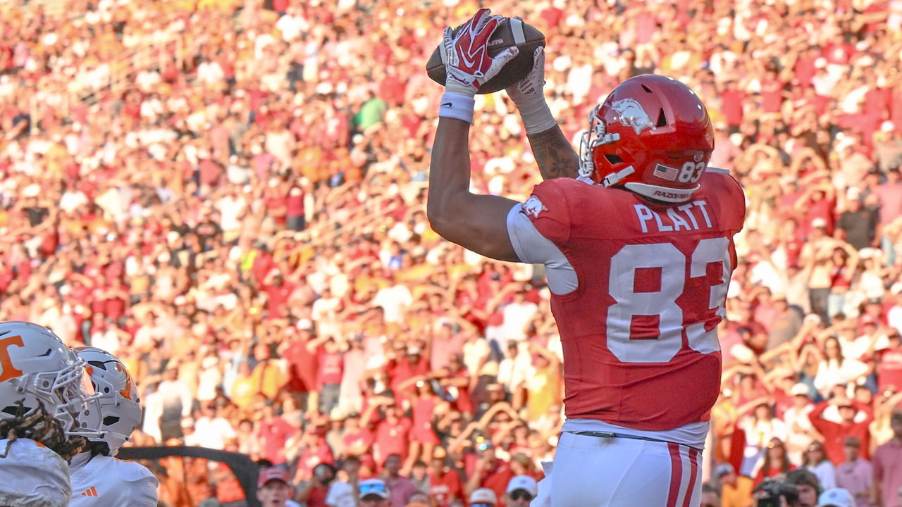 Arkansas Razorbacks tight end Jaden Platt catches a second-half touchdown pass with teammates against the Tennessee Volunteers at Razorback Stadium