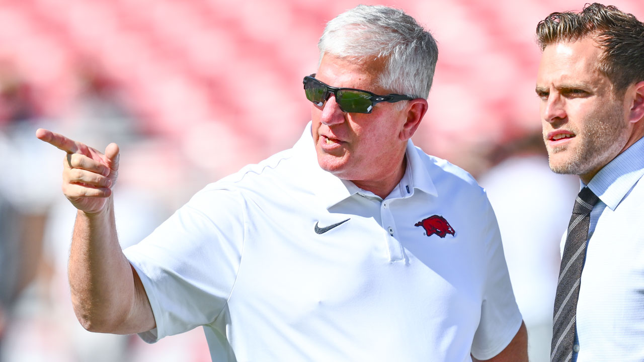 Arkansas Razorbacks defensive coordinator Ron Roberts on the field in warmups before game against the Tennessee Volunteers at Razorback Stadium