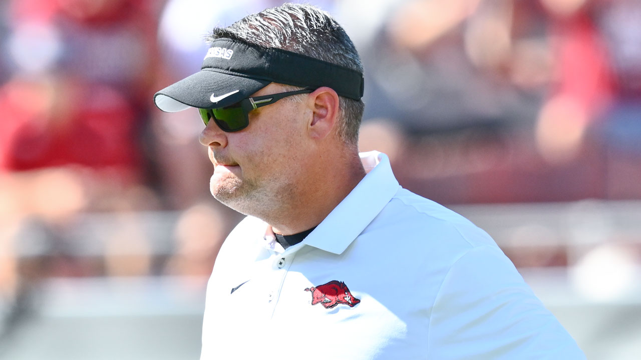 Arkansas Razorbacks offensive coordinator Tim Cramsey on the field in warmups before game against the Tennessee Volunteers at Razorback Stadium