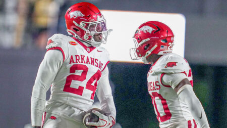 Arkansas Razorbacks defensive backs Miguel Mitchell and Joker Johnson celebrate after interception against the Vanderbilt Commodores