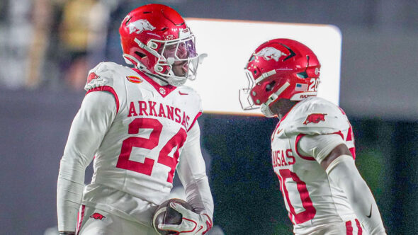 Arkansas Razorbacks defensive backs Miguel Mitchell and Joker Johnson celebrate after interception against the Vanderbilt Commodores