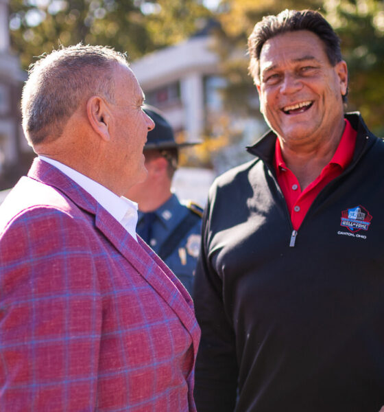 Former Arkansas Razorback football coach Sam Pittman with former Hog and Chicago Bear Dan Hampton before a game